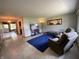 Inviting living room with a blue rug, comfortable seating, and natural light at 31 S Sugar Creek Dr, New Palestine, IN 46163