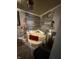 This bathroom features a tub with a unique stone tiled wall, accented by decorative statues and dim lighting at 3301 S Lockburn St, Indianapolis, IN 46221