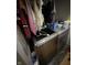 This laundry room has a modern washer and dryer unit with shelving and storage space at 3301 S Lockburn St, Indianapolis, IN 46221