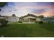 Charming single-story home featuring a well-maintained lawn and a detached garage at 3304 Coffey St, Indianapolis, IN 46217
