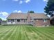 Expansive backyard with a well-maintained deck and lush green lawn at 3975 Keyway Dr, Greenwood, IN 46143