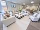 This staged living area features ample seating and bright neutral decor at 3975 Keyway Dr, Greenwood, IN 46143