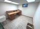 Unfinished basement with desk, tile floors, and natural light from the window at 3975 Keyway Dr, Greenwood, IN 46143