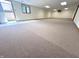 This carpeted basement offers lots of open space and a walkout exit at 3975 Keyway Dr, Greenwood, IN 46143