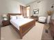 Serene bedroom with a wood framed bed, neutral walls, and classic decor at 3975 Keyway Dr, Greenwood, IN 46143