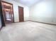 Simple bedroom featuring neutral walls and carpet and standard closet at 3975 Keyway Dr, Greenwood, IN 46143