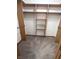 Walk-in closet with wooden shelving and ample space for storage and organization at 3975 Keyway Dr, Greenwood, IN 46143