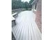 Exterior deck with built-in benches and room for entertaining, connected to the brick home at 3975 Keyway Dr, Greenwood, IN 46143