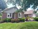 Charming brick home featuring well-maintained landscaping and classic architectural details at 3975 Keyway Dr, Greenwood, IN 46143