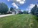 Well-manicured front yard with a spacious three-car garage and inviting curb appeal at 3975 Keyway Dr, Greenwood, IN 46143