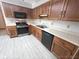 Kitchen features stainless steel appliances, countertops, and wooden cabinets at 3975 Keyway Dr, Greenwood, IN 46143