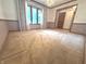 Bright and airy living room featuring carpet and large windows at 3975 Keyway Dr, Greenwood, IN 46143