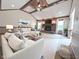 Relaxing living room with wood beam ceilings, fireplace, and neutral furnishings at 3975 Keyway Dr, Greenwood, IN 46143
