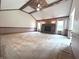 Spacious living room with fireplace, ceiling fan, and vaulted ceiling at 3975 Keyway Dr, Greenwood, IN 46143
