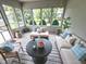 Cozy sunroom with lots of natural light, comfortable seating, and beautiful backyard views at 3975 Keyway Dr, Greenwood, IN 46143