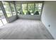 Enclosed sunroom featuring multiple windows with view of outdoors and neutral walls at 3975 Keyway Dr, Greenwood, IN 46143