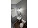 Cozy bathroom with a vanity, toilet, and natural light from the window at 4614 Runyon Lake W Dr, Greenwood, IN 46143