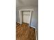 Bedroom closet, bi-fold doors, with wood floors and freshly painted walls at 4614 Runyon Lake W Dr, Greenwood, IN 46143