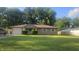 Charming single-story home with well-manicured lawn, stone facade, and attached garage at 4614 Runyon Lake W Dr, Greenwood, IN 46143