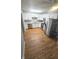 Modern kitchen featuring white cabinets, stainless steel appliances, and granite countertops at 4614 Runyon Lake W Dr, Greenwood, IN 46143