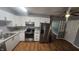Modern kitchen featuring white cabinets, stainless steel appliances, and granite countertops at 4614 Runyon Lake W Dr, Greenwood, IN 46143