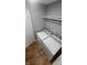 Laundry room area with washer and dryer hookups and storage shelving at 4614 Runyon Lake W Dr, Greenwood, IN 46143