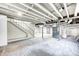 Spacious unfinished basement with exposed rafters and access stairs at 5430 N Kenwood Ave, Indianapolis, IN 46208