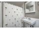 Bathroom featuring a vanity sink and shower with a whimsical palm tree shower curtain at 5430 N Kenwood Ave, Indianapolis, IN 46208