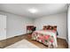 Bedroom boasts a bright aesthetic with hardwood floors and features space for a study area at 5430 N Kenwood Ave, Indianapolis, IN 46208