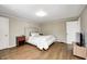 Spacious bedroom with hardwood floors, ensuite bathroom and neutral paint for personalization at 5430 N Kenwood Ave, Indianapolis, IN 46208