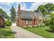 Beautiful brick home with a well-kept lawn, long driveway and detached garage at 5430 N Kenwood Ave, Indianapolis, IN 46208