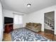 This living room has wood floors, area rug, neutral colors, tv, and lots of natural light at 5430 N Kenwood Ave, Indianapolis, IN 46208