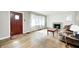 Inviting living room featuring hardwood floors, natural light, a decorative fireplace, and neutral walls at 5430 N Kenwood Ave, Indianapolis, IN 46208