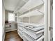 Walk-in closet providing an organized storage solution with shelving and drawer systems at 5430 N Kenwood Ave, Indianapolis, IN 46208