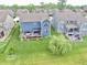 Overhead view of the home and backyard featuring a well-manicured lawn and mature trees at 5473 Forest Glen Dr, Brownsburg, IN 46112