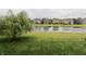 Wide backyard offers beautiful pond views and open green space, perfect for outdoor activities at 5473 Forest Glen Dr, Brownsburg, IN 46112