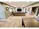 Finished basement with a modern entertainment area, a fireplace, and a ping pong table for recreation at 5473 Forest Glen Dr, Brownsburg, IN 46112
