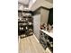 Basement bar area featuring a sleek liquor cabinet and wine storage at 5473 Forest Glen Dr, Brownsburg, IN 46112