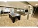 Spacious basement featuring a kitchenette, entertainment area, and comfortable seating, ideal for recreation at 5473 Forest Glen Dr, Brownsburg, IN 46112
