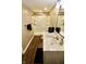 Modern bathroom with sleek white vanity, shower, and wood-look flooring at 5473 Forest Glen Dr, Brownsburg, IN 46112
