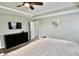 Cozy bedroom featuring a dresser with a TV, neutral walls, and plush carpet at 5473 Forest Glen Dr, Brownsburg, IN 46112