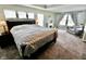 Spacious bedroom boasts large windows, a fireplace, and a comfortable seating area at 5473 Forest Glen Dr, Brownsburg, IN 46112