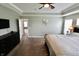 Bright bedroom with natural light showcasing bed and dresser at 5473 Forest Glen Dr, Brownsburg, IN 46112
