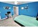 Cozy blue bedroom with a ceiling fan, a comfortable bed, and decor for a relaxed vibe at 5473 Forest Glen Dr, Brownsburg, IN 46112
