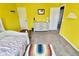 Sunny yellow bedroom, a cozy and inviting space at 5473 Forest Glen Dr, Brownsburg, IN 46112