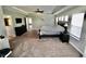 Bedroom with dark wood furnishings and adjoining bathroom entryway at 5473 Forest Glen Dr, Brownsburg, IN 46112
