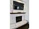 Charming stone fireplace with a decorative mantle, creating a cozy focal point in the home at 5473 Forest Glen Dr, Brownsburg, IN 46112