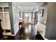 Foyer featuring a stylish console table with lamp and decor and dark hardwood flooring at 5473 Forest Glen Dr, Brownsburg, IN 46112