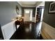 Inviting foyer featuring dark hardwood floors and views into the living spaces at 5473 Forest Glen Dr, Brownsburg, IN 46112