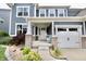 Inviting two-story home with a cozy front porch and charming curb appeal at 5473 Forest Glen Dr, Brownsburg, IN 46112